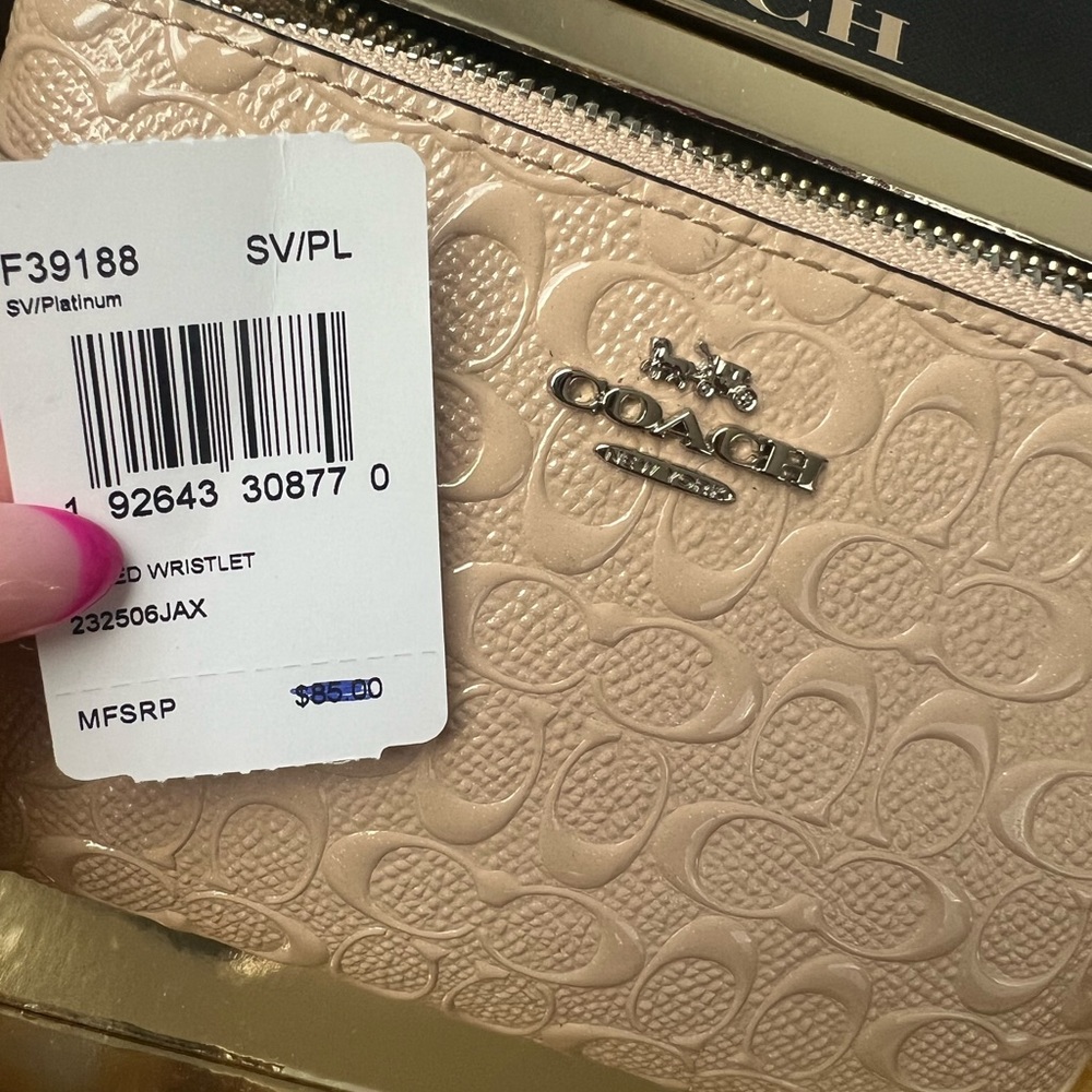$50 OBO!!!! Used once, blush/cream colored Coach wristlet